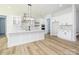 Spacious kitchen with a large island, marble countertops, and modern lighting fixtures at 1022 Harrogate Dr, Bessemer City, NC 28016