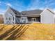 Rear exterior of the home showcasing the siding, windows, and covered patio at 1022 Harrogate Dr, Bessemer City, NC 28016