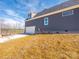 Side exterior with attached garage, long driveway, and professionally landscaped yard at 1022 Harrogate Dr, Bessemer City, NC 28016