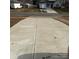 Long, spacious concrete driveway providing ample parking space for multiple vehicles at 1111 Pondella Dr # 66, Charlotte, NC 28213