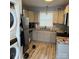 Well-lit kitchen featuring gray cabinets, stainless steel appliances, and stylish countertop at 1111 Pondella Dr # 66, Charlotte, NC 28213