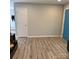 Spacious living room with vinyl flooring and doors at 1111 Pondella Dr # 66, Charlotte, NC 28213