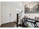 Inviting foyer with dark wood floors, a staircase, and decor on a table at 1129 Doveridge St, Charlotte, NC 28273