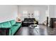 Bright living room features dark hardwood floors, modern furniture, and a glass coffee table at 1129 Doveridge St, Charlotte, NC 28273