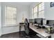 A home office with two computer monitors, a desk, and a comfortable gaming chair at 1129 Doveridge St, Charlotte, NC 28273