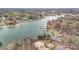 Scenic aerial view of a waterfront community with lush trees and multiple docks along the tranquil water at 125 Lanyard Dr # E, Mooresville, NC 28117