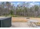 Cozy back patio featuring outdoor seating with a private wooded backdrop at 125 Lanyard Dr # E, Mooresville, NC 28117