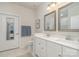 Elegant bathroom featuring a double sink vanity, neutral tile, and a modern aesthetic at 125 Lanyard Dr # E, Mooresville, NC 28117