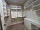 Spacious closet featuring custom shelving and built-in storage drawers for optimal organization at 125 Lanyard Dr # E, Mooresville, NC 28117