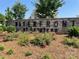 A stone community sign welcomes residents to Waterfront at Langtree with beautiful landscaping at 125 Lanyard Dr # E, Mooresville, NC 28117
