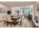 Open-concept dining room featuring modern decor and seamlessly flowing to living room and entry at 125 Lanyard Dr # E, Mooresville, NC 28117