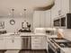 Bright, stylish kitchen with stainless steel appliances, white cabinets and quartz countertops at 125 Lanyard Dr # E, Mooresville, NC 28117
