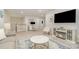 Bright living space with desk area, fireplace, TV, and comfortable seating with a marble table at 125 Lanyard Dr # E, Mooresville, NC 28117