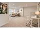 Spacious living room featuring cozy seating area, artwork, and a functional office space at 125 Lanyard Dr # E, Mooresville, NC 28117