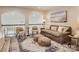 Open living area with comfortable seating, neutral decor, and natural light from the stairwell at 125 Lanyard Dr # E, Mooresville, NC 28117