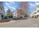 Exterior view of townhouses in a residential area, showing architectural details and street view at 1525 Walnut View Dr, Charlotte, NC 28208