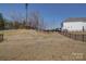 Large, fenced backyard, providing privacy and ample space for outdoor activities and landscaping at 15308 Lake Ridge Rd, Charlotte, NC 28278