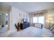 Cozy bedroom with a dresser and window with decorative curtains, creating a comfortable space at 15308 Lake Ridge Rd, Charlotte, NC 28278