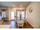Cozy dining area with glass-top table and stylish chairs, bathed in natural light at 15308 Lake Ridge Rd, Charlotte, NC 28278