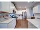 Well-equipped kitchen featuring white cabinets, stainless steel appliances, and a functional layout at 15308 Lake Ridge Rd, Charlotte, NC 28278