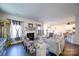 Comfortable living room with fireplace, elegant furnishings, and seamless flow to the kitchen and dining area at 15308 Lake Ridge Rd, Charlotte, NC 28278