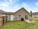 Backyard view featuring a patio area with table and chairs, plus a grill at 163 Brookshire Dr, Fort Mill, SC 29715