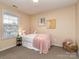 Comfortable bedroom with neutral walls, carpet, and a window with blinds at 163 Brookshire Dr, Fort Mill, SC 29715