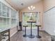 Bright dining area with vaulted ceilings, large windows, and sliding glass doors to the backyard patio at 163 Brookshire Dr, Fort Mill, SC 29715