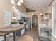 Open kitchen with stainless steel appliances, white cabinets, and views to dining area and living space at 163 Brookshire Dr, Fort Mill, SC 29715