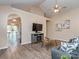 Inviting living room with vaulted ceilings, wood-look flooring, and neutral paint palette at 163 Brookshire Dr, Fort Mill, SC 29715
