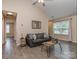 Inviting living room with vaulted ceilings, neutral walls, and wood-look floors for a modern touch at 163 Brookshire Dr, Fort Mill, SC 29715
