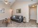 Comfortable living room featuring vaulted ceilings, neutral walls, and stylish furnishings at 163 Brookshire Dr, Fort Mill, SC 29715