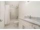 Bathroom features tub with shower, white cabinets, marble countertop, and a modern faucet at 1665 Sterling Rd, Charlotte, NC 28209