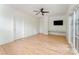 The bedroom has a ceiling fan, built-in desk, and large windows offering natural light at 1665 Sterling Rd, Charlotte, NC 28209
