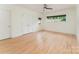 Bedroom with hardwood floors, a ceiling fan, and multiple windows for ample natural light at 1665 Sterling Rd, Charlotte, NC 28209