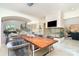 Dining area featuring an elegant chandelier, contemporary fireplace, and staircase, perfect for entertaining at 1665 Sterling Rd, Charlotte, NC 28209