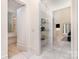 Bright hallway features marble floors, glass shelving and access to the rest of the house at 1665 Sterling Rd, Charlotte, NC 28209