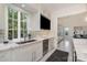 Bright kitchen features a large window, stainless steel appliances and custom cabinets at 1665 Sterling Rd, Charlotte, NC 28209