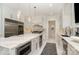 Modern kitchen features a large marble island, stainless steel appliances and lots of storage at 1665 Sterling Rd, Charlotte, NC 28209