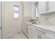 Laundry room features custom cabinets and marble countertops at 1665 Sterling Rd, Charlotte, NC 28209