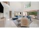 Open-concept living area with marble floors, high ceilings, comfortable seating, and seamless access to the outdoor space at 1665 Sterling Rd, Charlotte, NC 28209