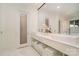 Bright main bathroom featuring double sinks, marble countertop, and glass enclosed shower at 1665 Sterling Rd, Charlotte, NC 28209