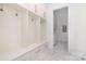 Mudroom features cubbies, hooks, storage and access to a laundry room at 1665 Sterling Rd, Charlotte, NC 28209