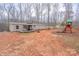 Spacious backyard with a deck, gazebo, and playset provides an outdoor entertainment area at 1795 Kestrel Valley Ln, Catawba, NC 28609