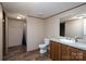 Well-lit bathroom includes a vanity and mirror, toilet, and a tub/shower combination at 1795 Kestrel Valley Ln, Catawba, NC 28609