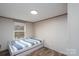Bedroom with a twin bed and a window providing natural light at 1795 Kestrel Valley Ln, Catawba, NC 28609