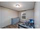 Neutral bedroom has a dresser, window and a car-themed bed at 1795 Kestrel Valley Ln, Catawba, NC 28609