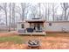 Covered gazebo on a wooden deck featuring an outdoor table, grill, and seating area at 1795 Kestrel Valley Ln, Catawba, NC 28609