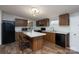 Charming kitchen featuring wood cabinets, an island with seating, and modern appliances at 1795 Kestrel Valley Ln, Catawba, NC 28609