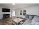 Living room with a comfortable couch, fireplace, and bright natural light at 1795 Kestrel Valley Ln, Catawba, NC 28609